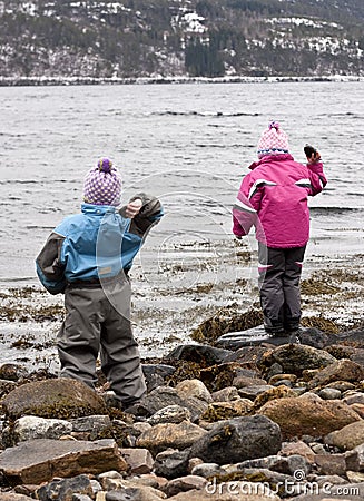 Children throwing rocks