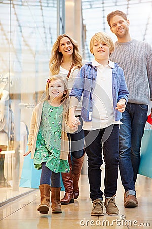 Children On Trip To Shopping Mall With Parents