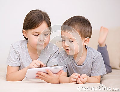 Children using tablet computer