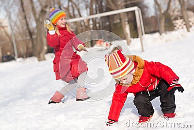 Children in Winter Park playing snowballs