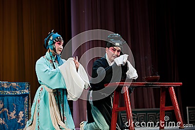 China opera man and woman Kneel