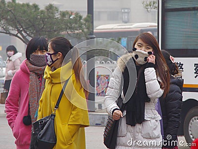 China xian haze still landmark tower looms (citizens and tourists travel in masks to protect health)