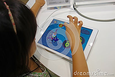 Chinese child playing ipad