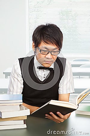 Chinese college male student studying