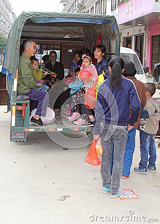 Chinese families in a retro tuk tuk,Xingping,China
