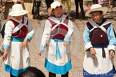 Chinese Naxi old woman performing a dance.