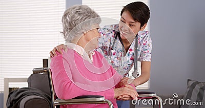 Chinese nurse talking with Senior patient