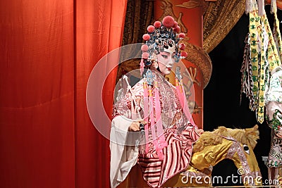 Chinese opera dummy and red cloth as text space