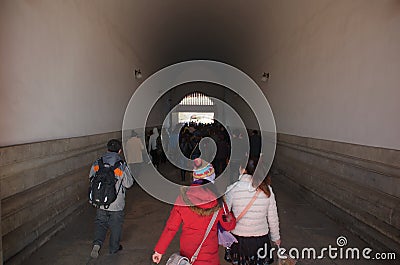 Chinese People And Tourists Walking Through The Tiananmen Gate Into The Forbidden City In Beijing, China