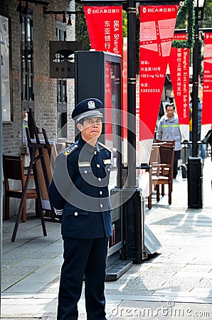 Chinese security guard stands alert Shanghai, China