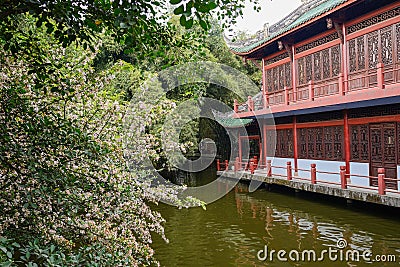 Chinese traditional building by river in spring