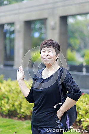 Chinese woman waving hand