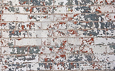 Chipped red white blue paint brick wall