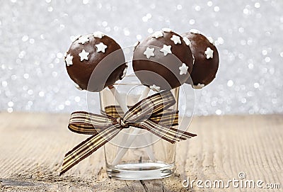 Chocolate cake pops decorated with sugar stars