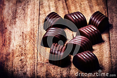 Chocolate truffles on wooden table with copyspace. Chocolate bon