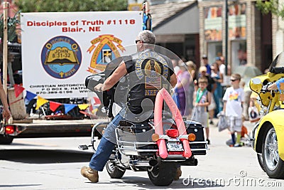Christian Motorcycle Club in parade in small town America