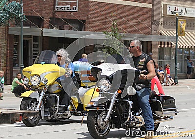 Christian Motorcycle Club Riders in parade in small town America