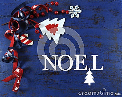 Christmas background with felt decorations on dark blue vintage wood with Noel letters