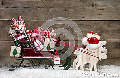 Christmas card decoration: elks pulling santa sleigh with gifts