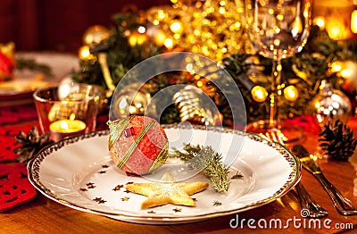 Christmas eve dinner party table setting with decorations
