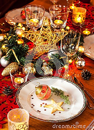 Christmas eve dinner party table setting with decorations