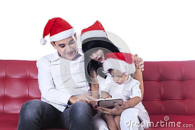 Christmas family using digital tablet