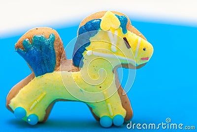 Christmas gingerbread cake pony with icing and decoration on brown
