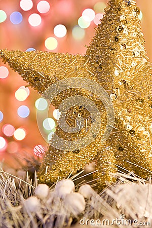 Christmas gold star on lights background