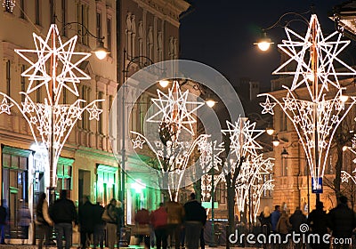 Christmas lights on street with people