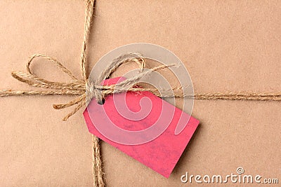 Christmas Present With Red Gift Tag Closeup