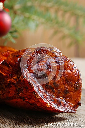 Christmas smoked ham under fir branch