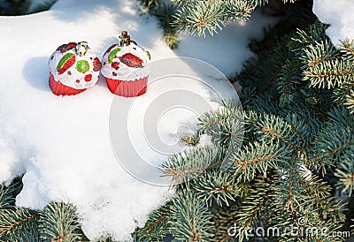 Christmas toy cakes on winter tree with snow