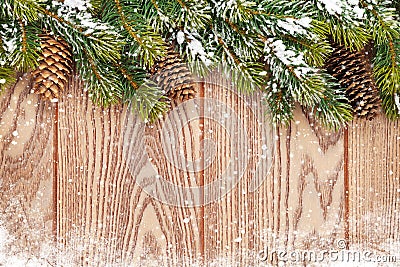 Christmas wooden background with snow fir tree
