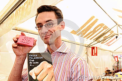 Chuck Palahniuk, author of the novel Fight Club, which also was made into a feature film, signs books in the streets of Barcelona
