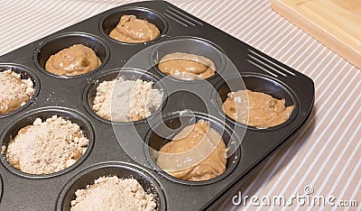 Cinnamon And Apple Muffin Mixture In Patty Tin.