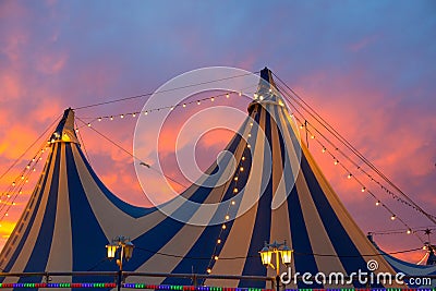 Circus tent in a dramatic sunset sky colorful