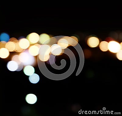 City lights in the background with blurring spots of light
