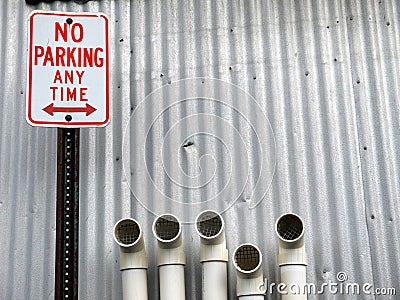 City: No Parking sign with pipes