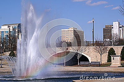 Cityscape with Rainbow in Water Fountain