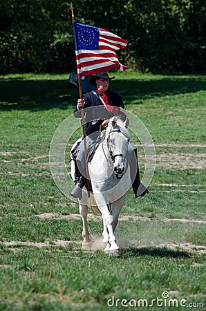 Union soldier on horse with flag