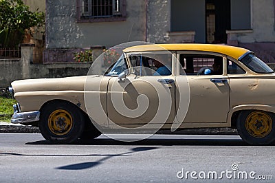 A classic car driver on the street in havana city