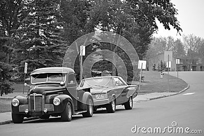 Classic cars parked on street - black and white