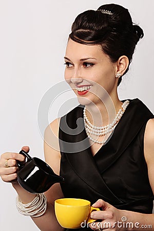 Classic lady serving tea at breakfast