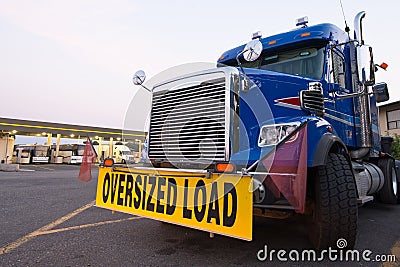 Classic truck big rig blue sign oversized load truck stop