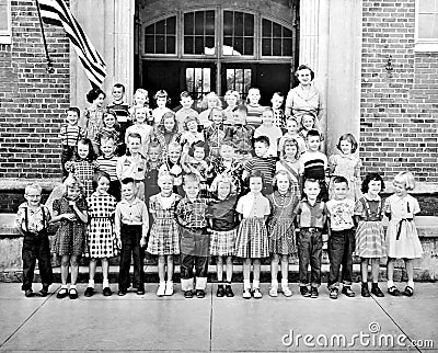 Classroom of Kids and a Teacher in Front of Building