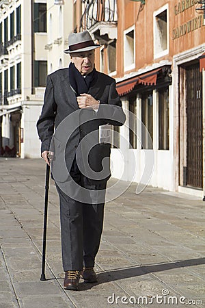 Classy old man walking in Venice.