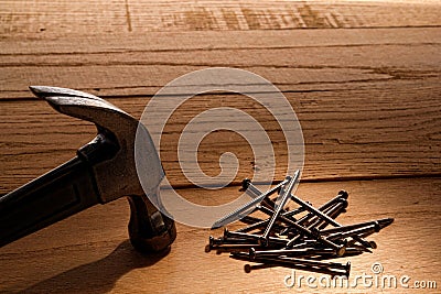 Claw Hammer and Nails on Wood Boards