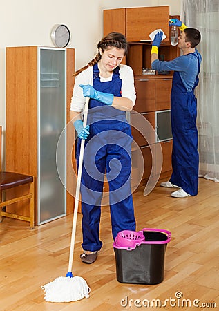 Cleaners cleaning in room