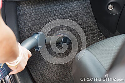 Cleanning a car by using vacuum cleanner