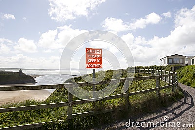 Cliff edge please keep to footpath sign